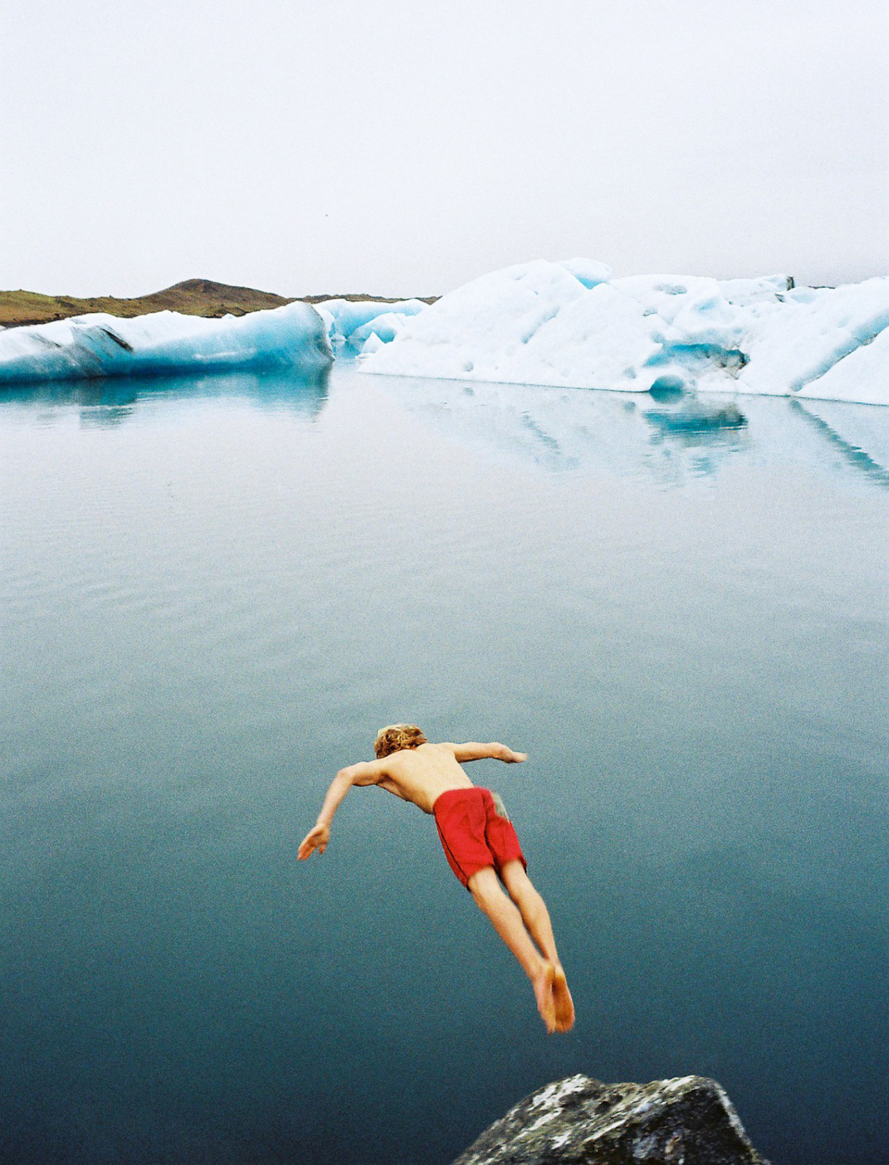 Diving into glacial Iceland waters. Photo by James Bowden