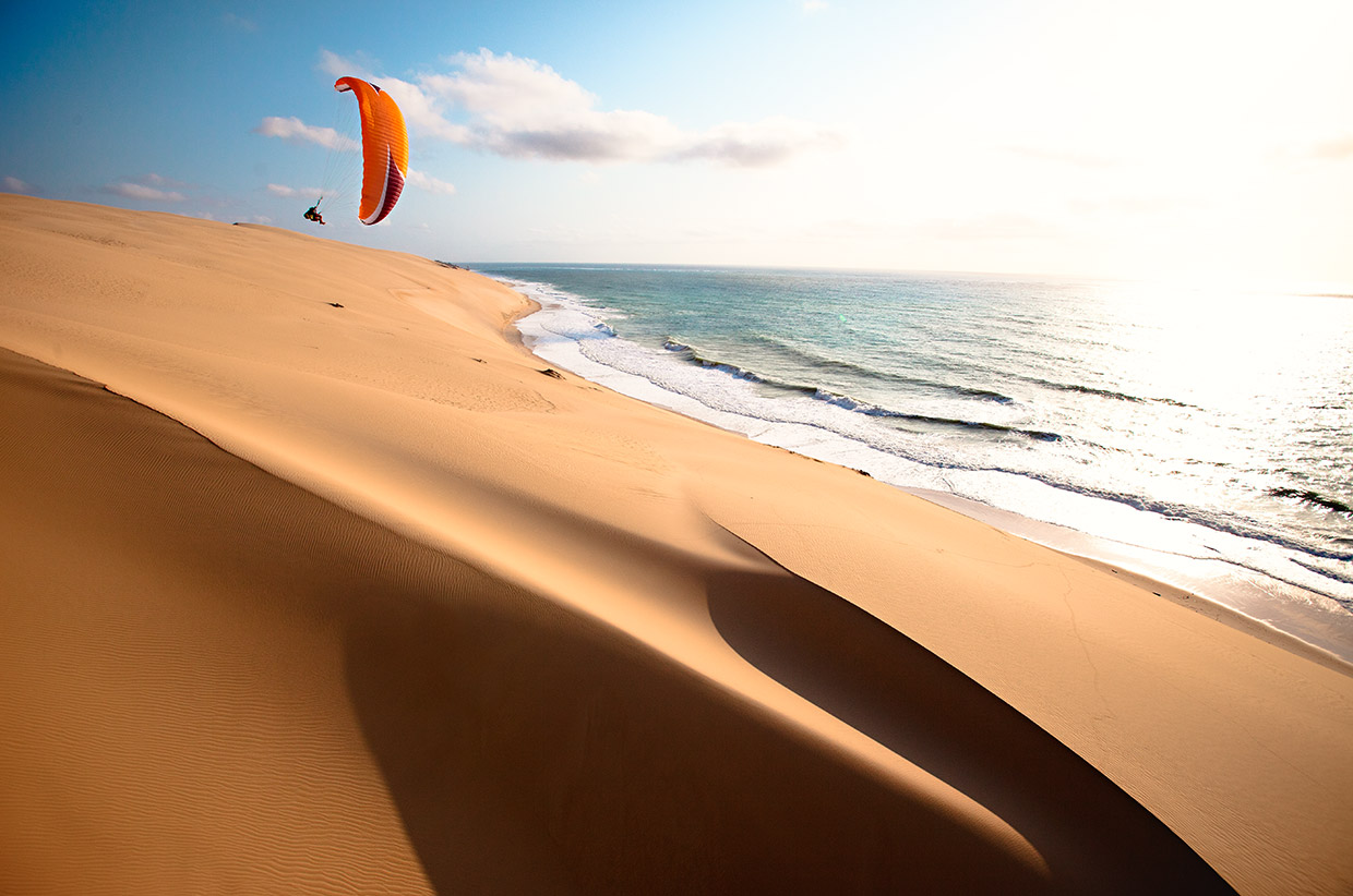 paraglider-banking-turn-sea-and-ocean-shadows-foreground-mozambique- - Photo by Jody MacDonald