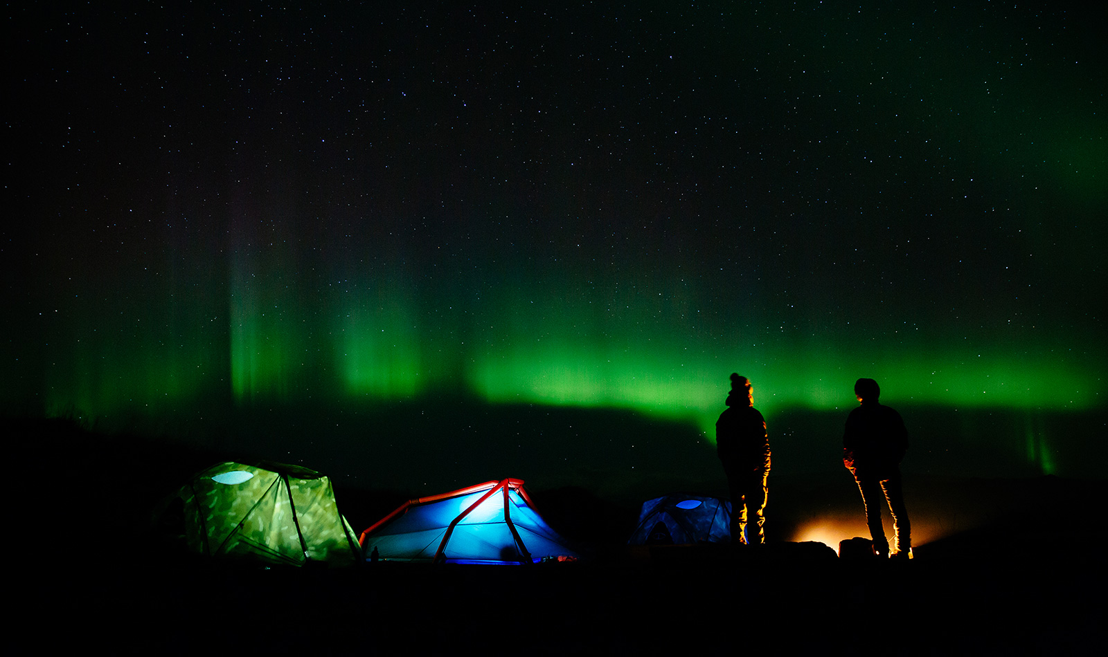 Camping under the Northern Lights. Photo by James Bowden
